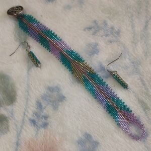 Green and Purple Beaded Bracelet with Intricate Design